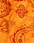 Close-up of RF-Wear Women's Split Paisley Shorts in Red/Gold