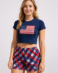 Woman wear a USA flag shirt and RF-Wear Women's Patriotic Plaid Shorts in Red/White/Blue