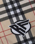 Close-up of RF-Wear Women's Tartan Plaid Shorts in Tan/Black with RF logo