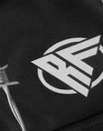 Close-up of RF-Wear Women's Reflective Barb Wire Shorts in Black with RF logo