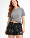 Woman wear a grey t-shirt and RF-Wear Women's Reflective Barb Wire Shorts in Black