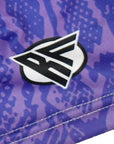 Close-up purple snakeskin shorts with brand logo