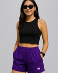Woman wearing a black top and RF-Wear Women's Solid Color Shorts in Purple