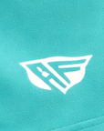 Close-up of RF-Wear Women's Solid Color Shorts in Teal with RF logo