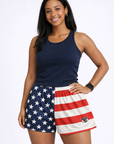 Woman wearing a navy top and RF-Wear Women's Split Flag Shorts in Red/White/Blue