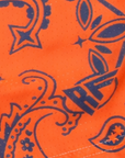 Close-up of RF-Wear Women's Split Paisley Shorts in Navy/Orange with RF logo