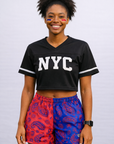 Woman wearing a black cropped top and RF-Wear Women's Split Paisley Shorts in Red/Blue