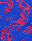 Close-up of RF-Wear Women's Split Paisley Shorts in Red/Blue with RF logo