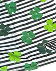 Close-up of RF-Wear Women's Split Shamrock Shorts in Black/Green with RF logo