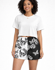 Woman Wearing a white top and RF-Wear Women's Split Skull Shorts in Black/White
