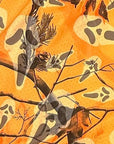 Close-up of RF-Wear Women's Tree Camo Ghost Faces Shorts in Orange