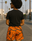 Woman wearing RF-Wear Women's Tree Camo Shorts - Orange - Back View