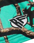 Close-up of RF-Wear women's teal tree camo shorts with brand logo