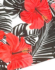 Close-up of RF-Wear Women's Tropical Flower in Coral on Black/White Shorts with RF logo
