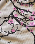 Close-up of a fabric with cherry blossom pattern on a beige background