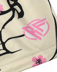 Close up of RF-Wear Women's Blossom Shorts in Cream/Pink with RF logo