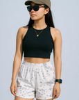 Woman wearing a black top with RF-Wear Women's Desert Camo Shorts in White/Grey