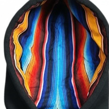 Close up of satin lined hood on the black Baja hoodie.