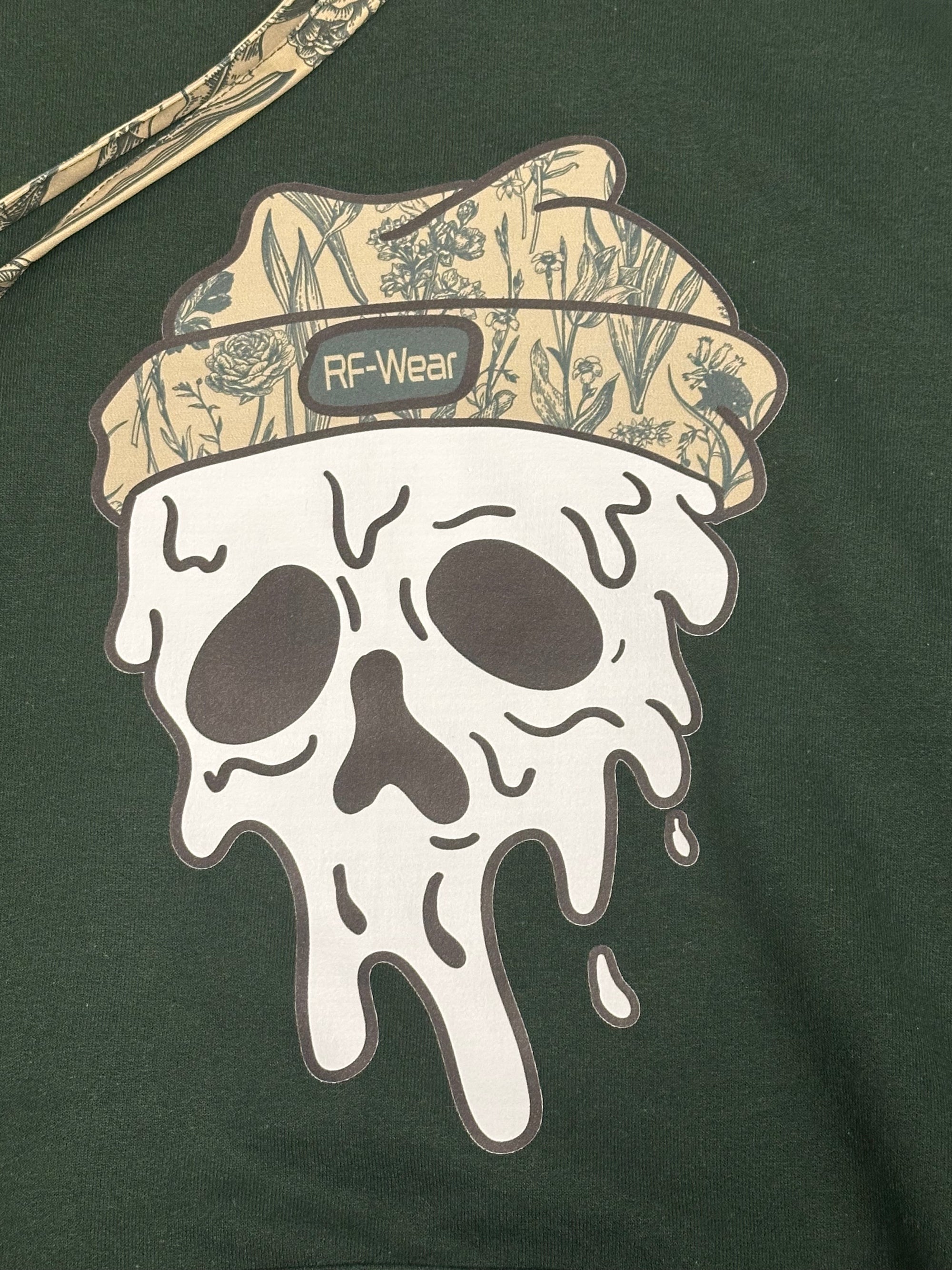 Close-up RF-Wear Beanie Skull Hoodie in Forest with Porcelain Sage  beanie skull graphic.
