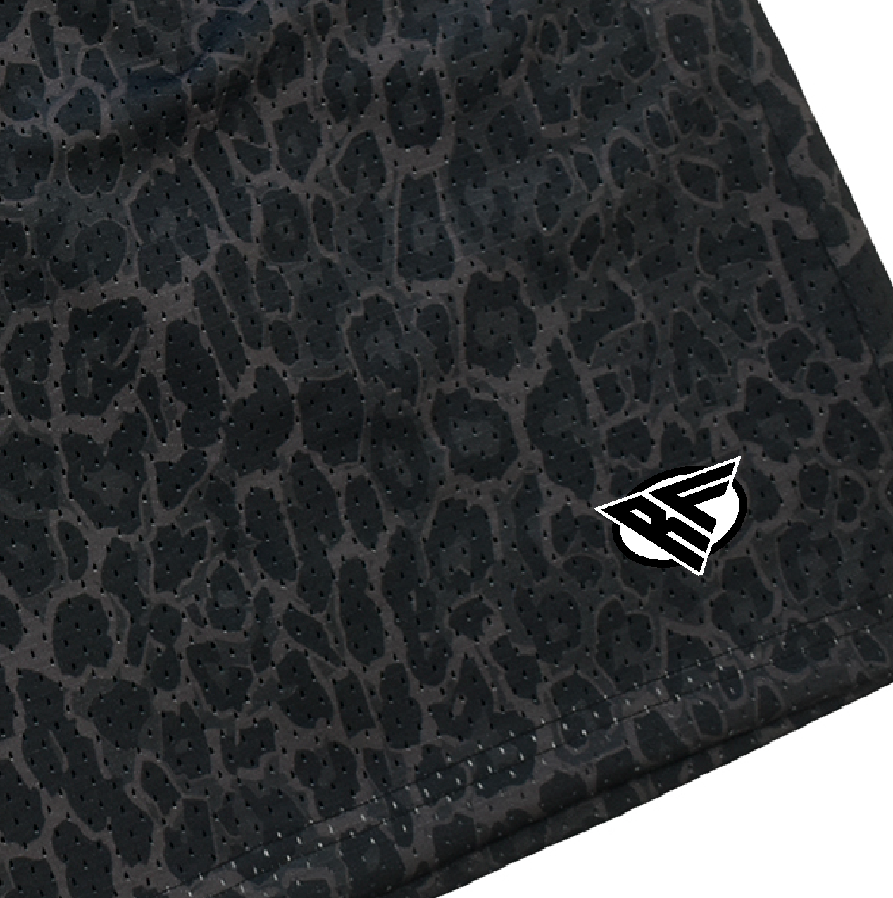 Close-up of RF-Wear Men's Animal Print Shorts - Leopard in Black with RF logo
