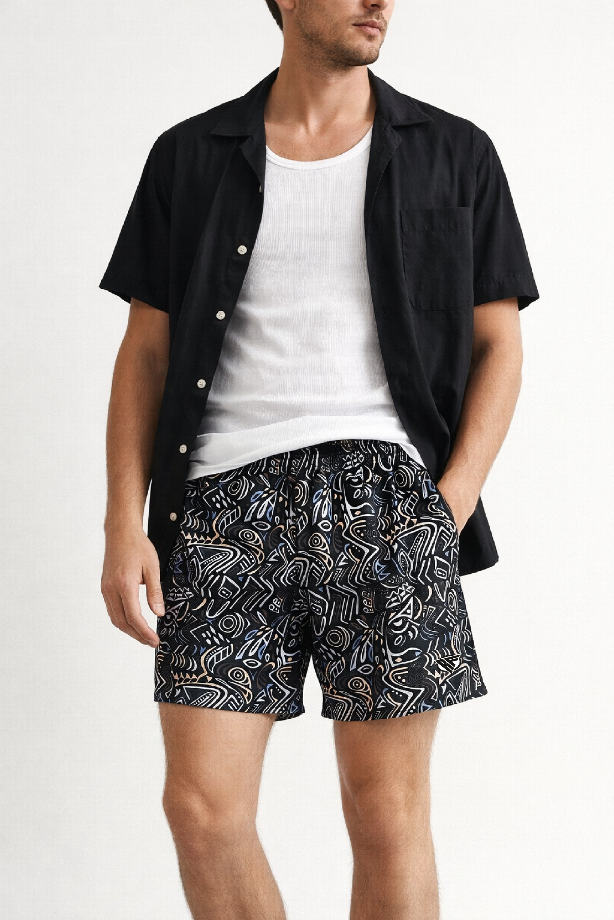 Man wearing a white tank top with unbuttoned black short sleeve shirt and RF-Wear Men's Aztec Print Shorts