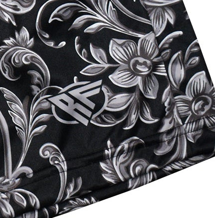 Black fabric with white floral patterns and a brand logo.