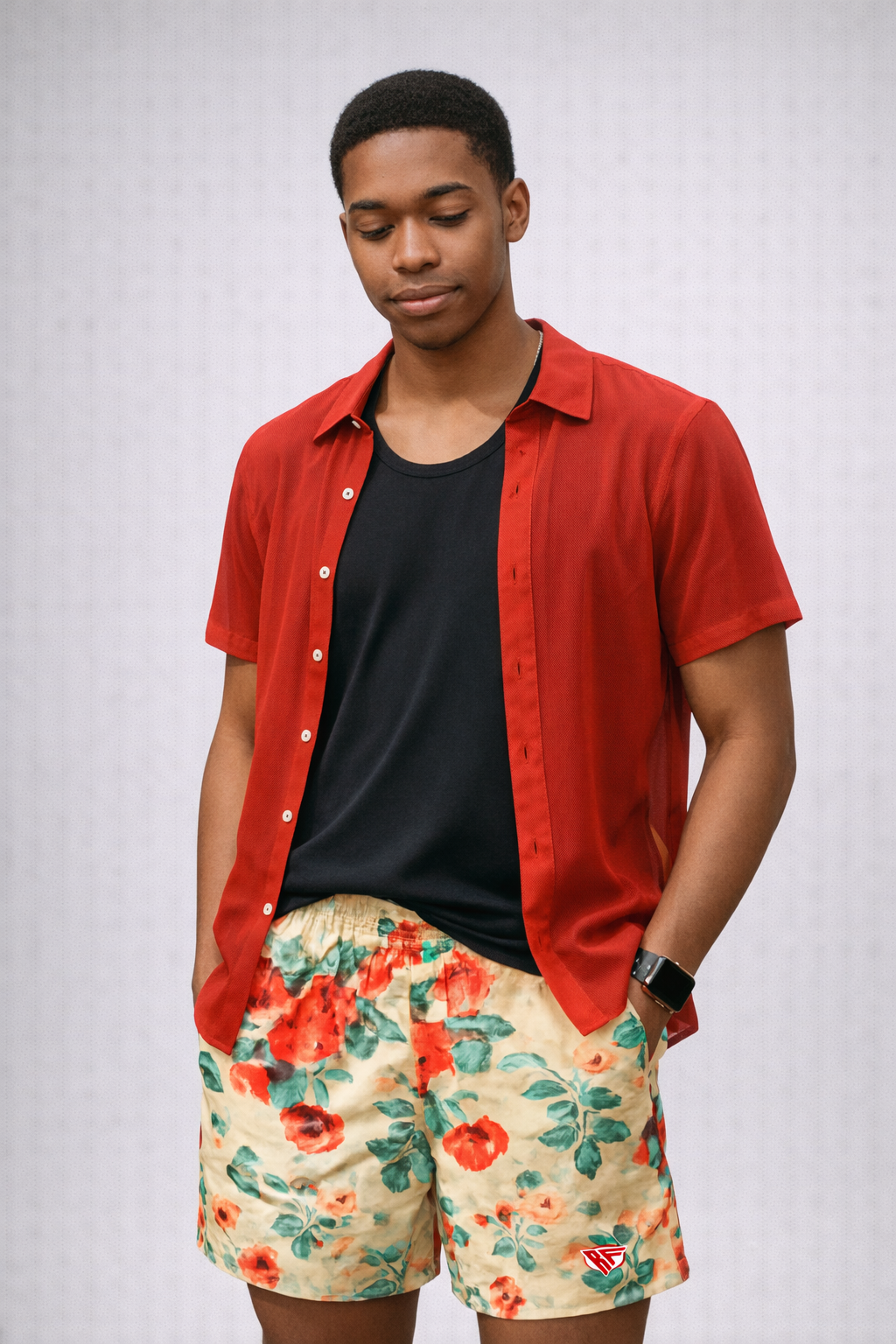 Man wearing a top and RF-Wear Men's Floral Shorts in Cream/Red/Peach  