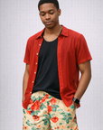 Man wearing a top and RF-Wear Men's Floral Shorts in Cream/Red/Peach  