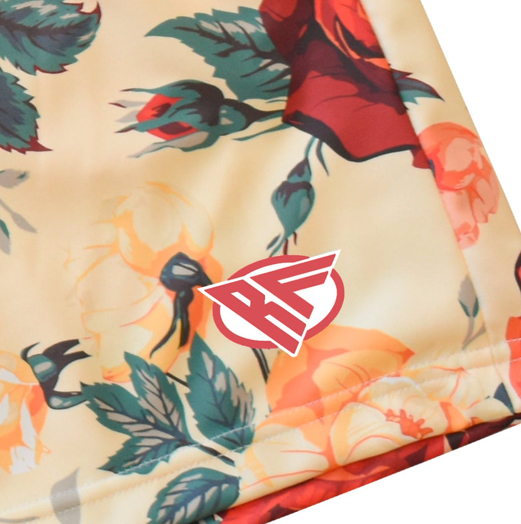 Close-up of RF-Wear Men's Floral Shorts in Cream/Red/Peach with RF logo