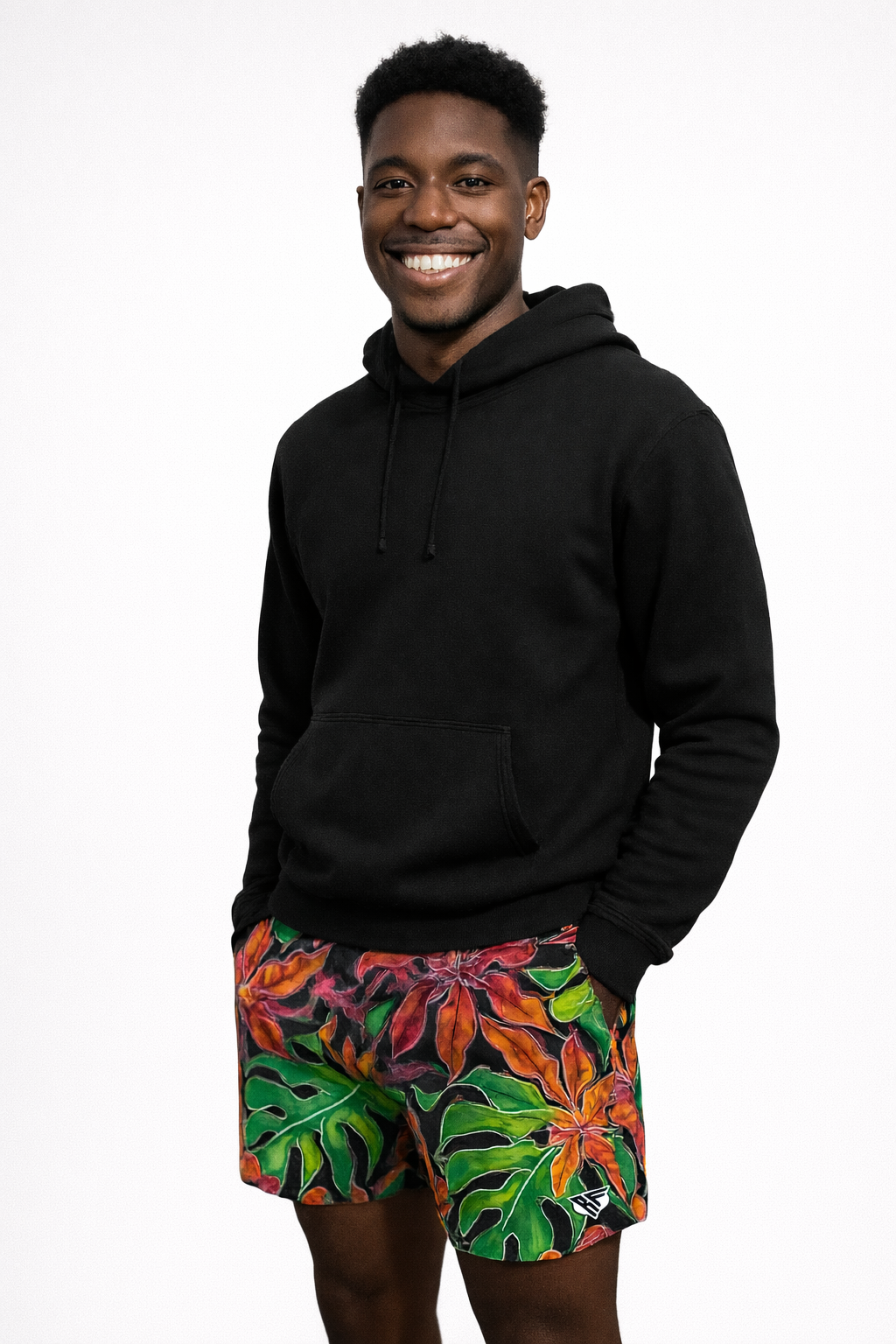 Man wearing a black hoodie and RF-Wear Men's Floral Tropical Vibe Shorts in Multicolors