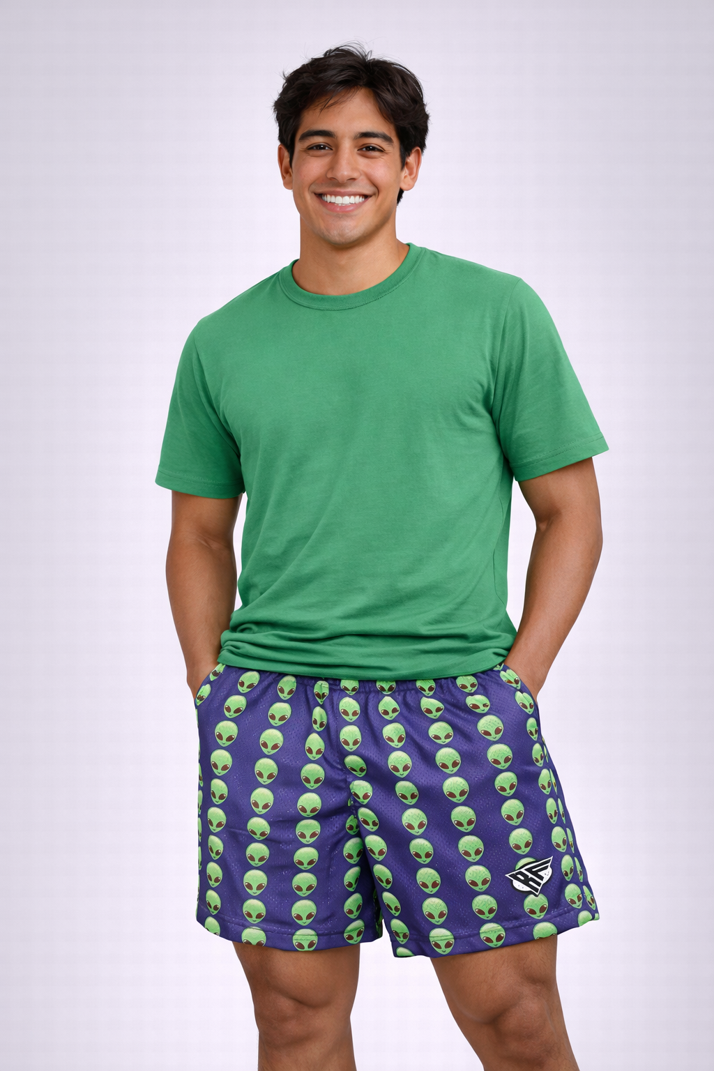 Man wearing a green t-shirt and RF-Wear  Men's Mesh Alien Shorts in Purple / Green