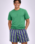 Man wearing a green t-shirt and RF-Wear  Men's Mesh Alien Shorts in Purple / Green