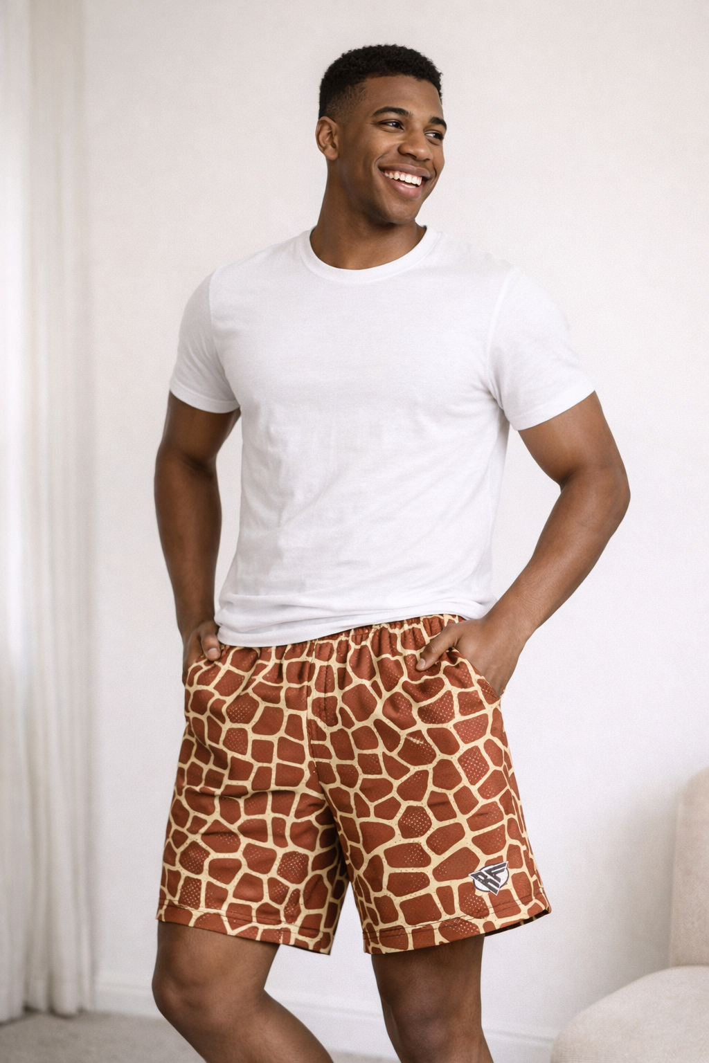 Man wearing a white t-shirts and RF-Wear Men's Mesh Animal Print Shorts  - Giraffe - Brown/Yellow