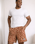 Man wearing a white t-shirts and RF-Wear Men's Mesh Animal Print Shorts  - Giraffe - Brown/Yellow