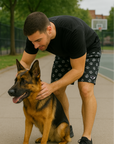 Man with dog wearing a black t-shirt and RF-Wear Men's Mesh Animal Print Shorts  - Paw Prints in Black/Grey 