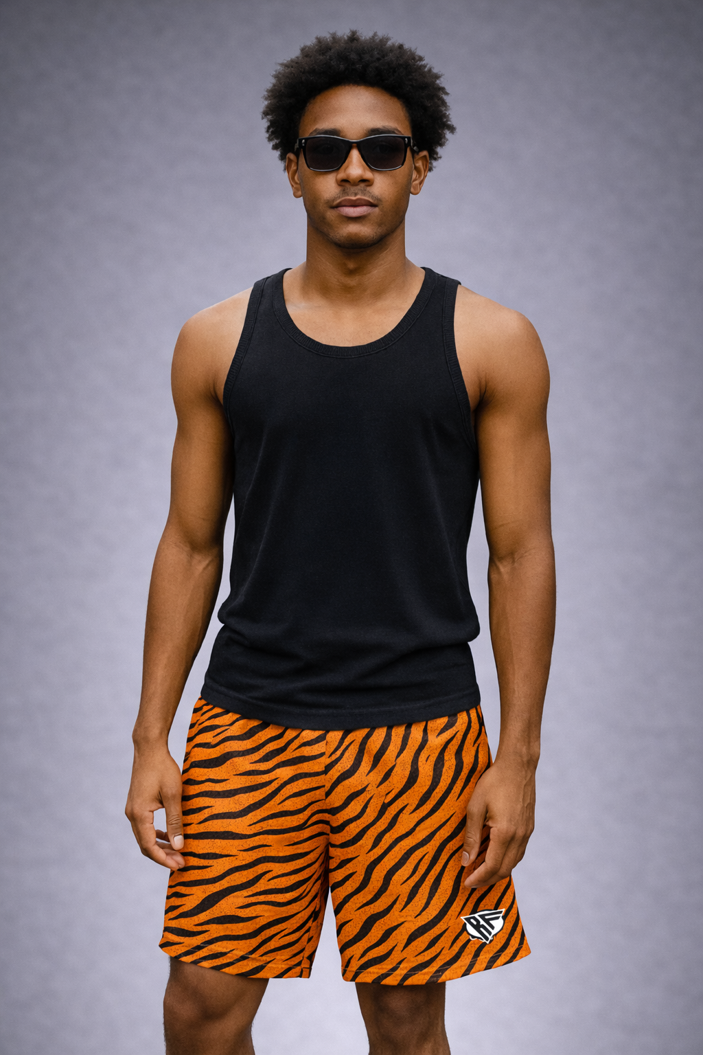 Woman wearing a black tank top and RF-Wear Men's Mesh Animal Print Shorts  - Tiger - Orange/Black
