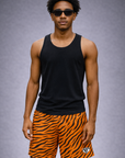 Woman wearing a black tank top and RF-Wear Men's Mesh Animal Print Shorts  - Tiger - Orange/Black