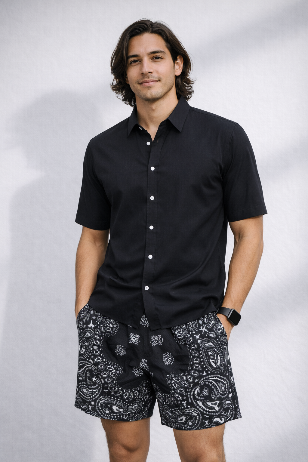 Man wearing a black shirt and RF-Wear Men's Mesh Bandana Shorts in Black.