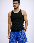 Man wearing a black tank top and RF-Wear Men's Mesh Bandana Shorts in blue. 