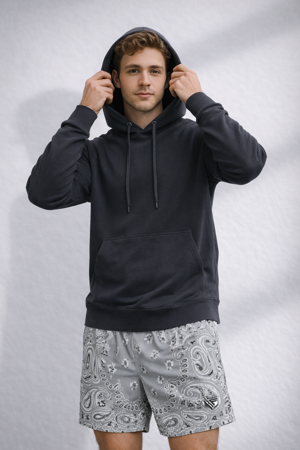 Man wearing a black hoodie and RF-Wear Men's Mesh Bandana Shorts in Grey