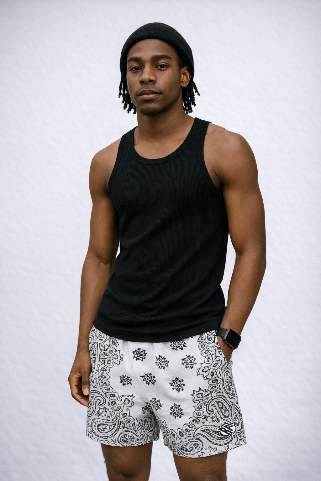 Man wearing a black tank top and RF-Wear Men's Mesh Bandana Shorts in White 