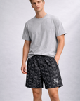 Man wearing a grey t-shirt and RF-Wear Men's Mesh Butterfly Shorts in Black 