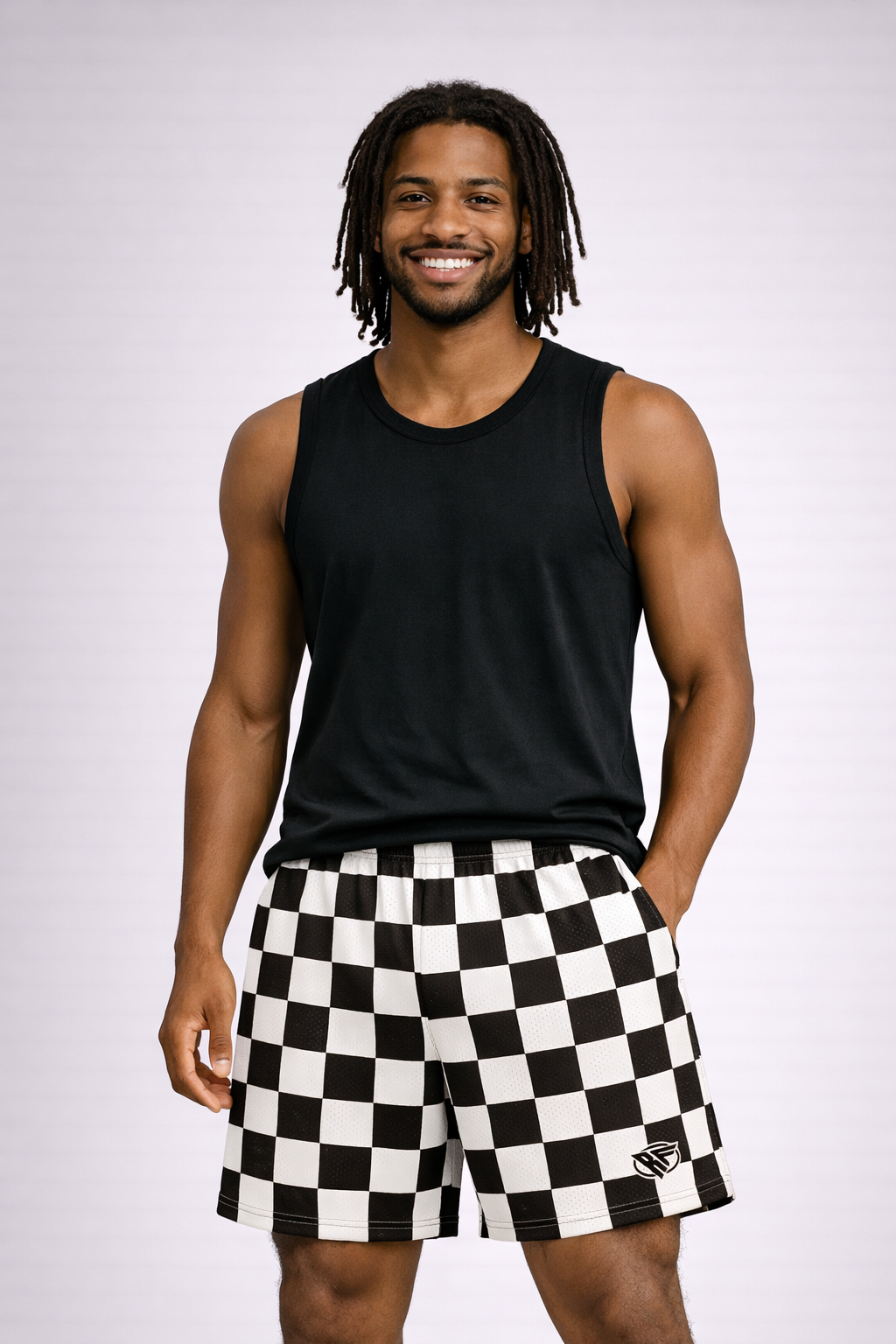 Man wearing a black tank top and RF-Wear Men's Mesh Checkered Shorts in Black/White 