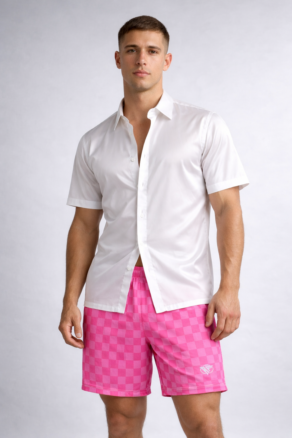 Man wearing a white dress shirt and RF-Wear Men's Mesh Checkered Shorts in Fuchsia/Pink
