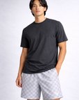 Man wearing a dark grey t-shirt and RF-Wear Men's Mesh Checkered Shorts in Grey