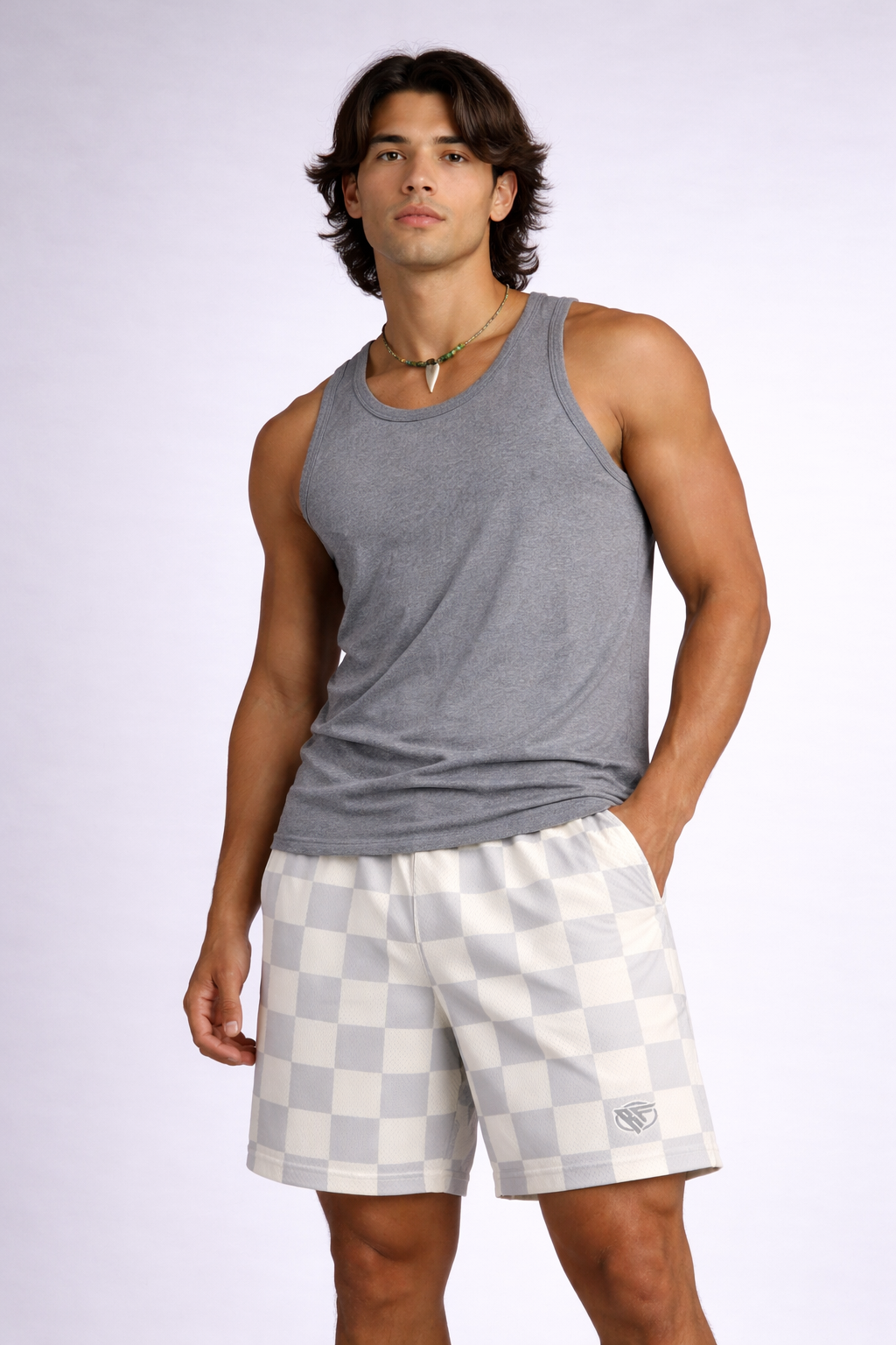 Man wearing a grey tank top and RF-Wear Men's Mesh Checkered Shorts in Grey/Cream 