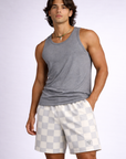Man wearing a grey tank top and RF-Wear Men's Mesh Checkered Shorts in Grey/Cream 