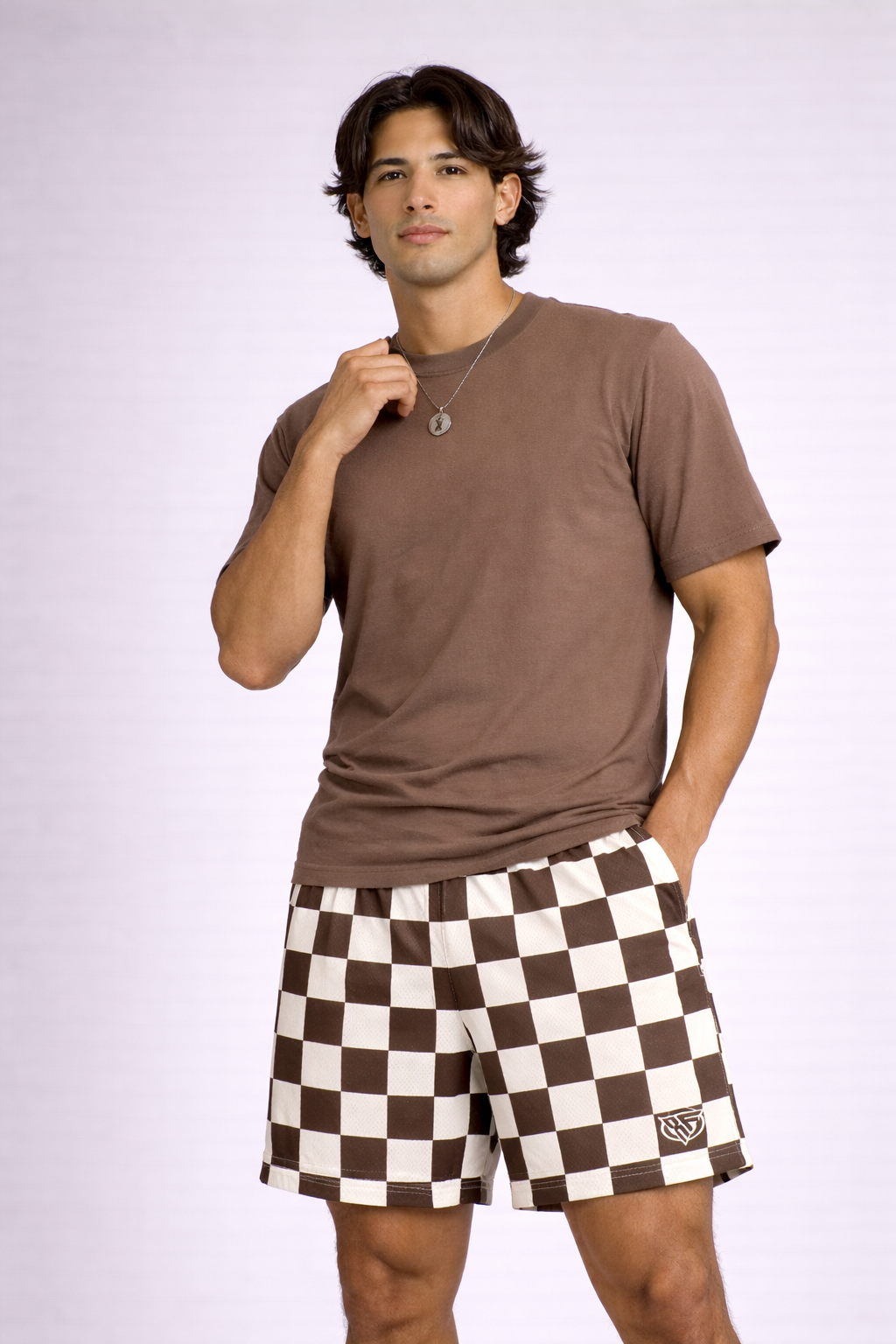 Man wearing a mocha colored t-shirt and RF-Wear Men's Mesh Checkered Shorts in Mocha/Cream 