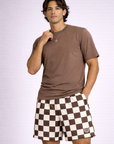 Man wearing a mocha colored t-shirt and RF-Wear Men's Mesh Checkered Shorts in Mocha/Cream 