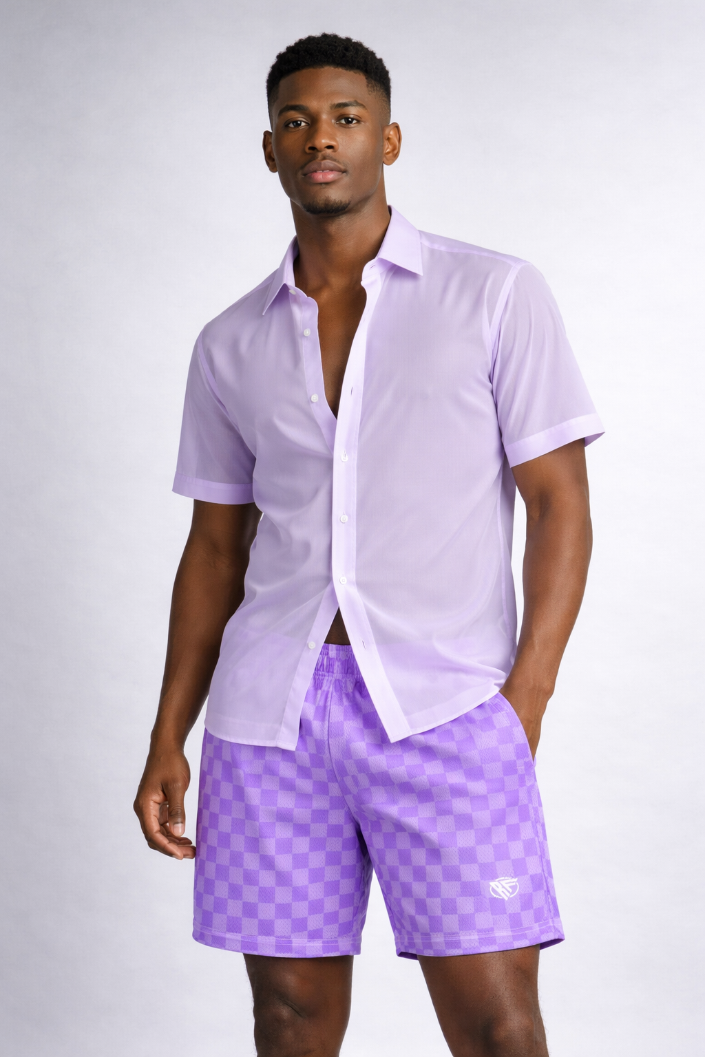 Man wearing a sheer light lilac dress shirt and RF-Wear Men's Mesh Checkered Shorts in Purple